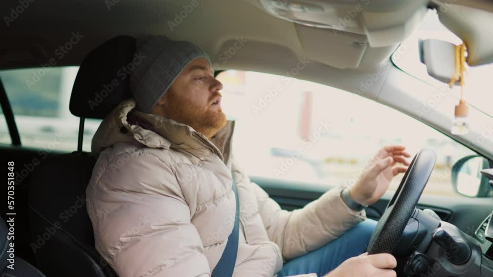 A frustrated driver with sore eyes and a headache A frustrated driver with sore eyes and a headache