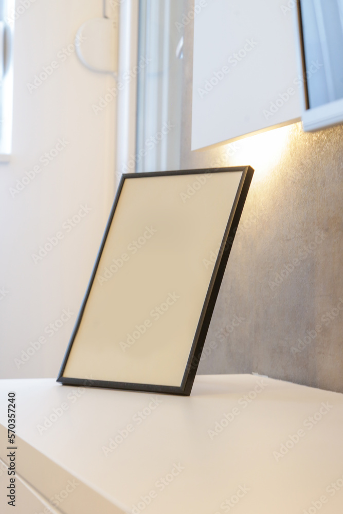 Blank photo frame on table in the room Blank photo frame on table in the room