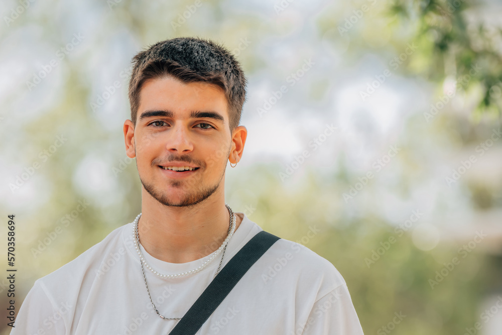 smiling portrait of young man outdoors smiling portrait of young man outdoors