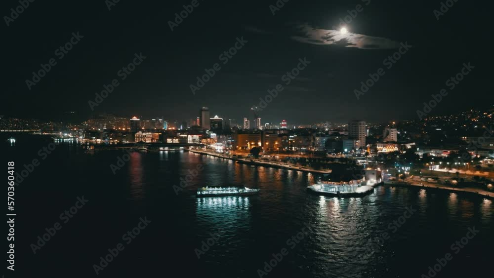 Aerial night shot over the sea with the ferryboats and city views in Konak Izmir Turkey. High quality 4k footage Aerial night shot over the sea with the ferryboats and city views in Konak Izmir Turkey. High quality 4k footage
