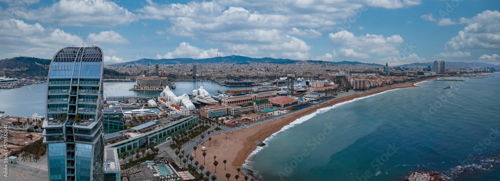 Panoramic aerial view of famous Barceloneta beach with hotel luxury W Barcelona. Birds eye of Barcelona, Catalunya, Spain.