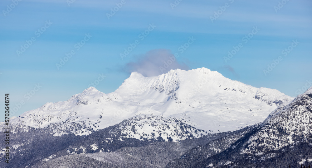 Obraz premium Snow and Cloud covered Canadian Nature Landscape Background. Winter Season in Whistler, British Columbia, Canada. From Blackcomb Mountain