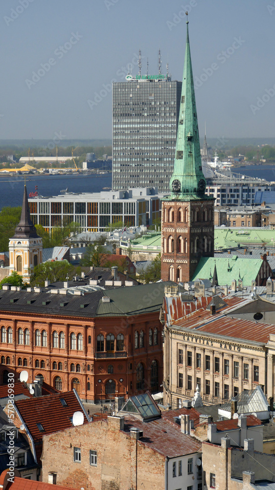 Churches and modern buildings .  The skyline of Riga.