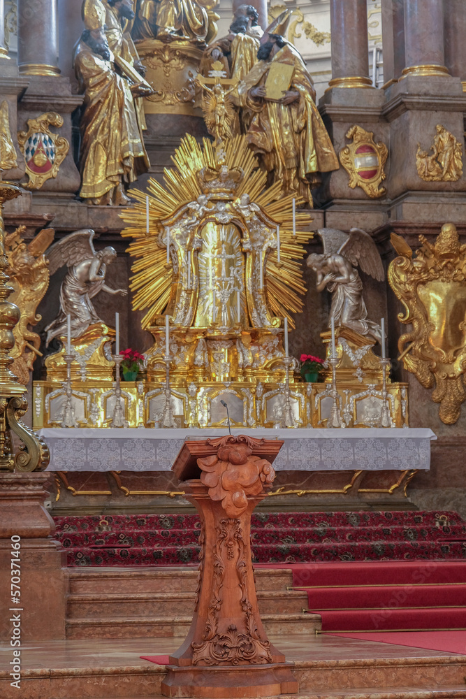 Fototapeta premium Magnificent opulent splendid Bavarian baroque church cathedral basilica interiors with stucco, murals, altar, Pilars, ceiling paintings, gold, wood domes nave 