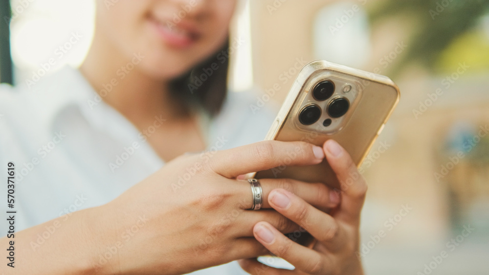 Close-up of young woman's hands using mobile phone Close-up of young woman's hands using mobile phone
