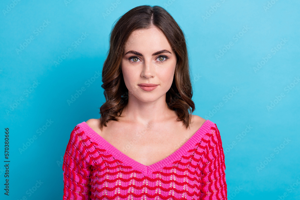 Closeup portrait of serious attractive perfect nice lady brown wavy hairstyle wear pink knitted jumper look you isolated on blue color background Closeup portrait of serious attractive perfect nice lady brown wavy hairstyle wear pink knitted jumper look you isolated on blue color background