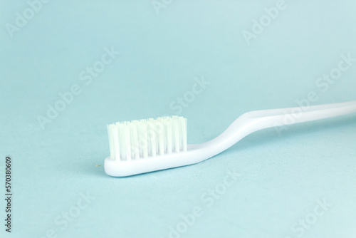 New toothbrush close-up on a blue background. Professional Dental concept.