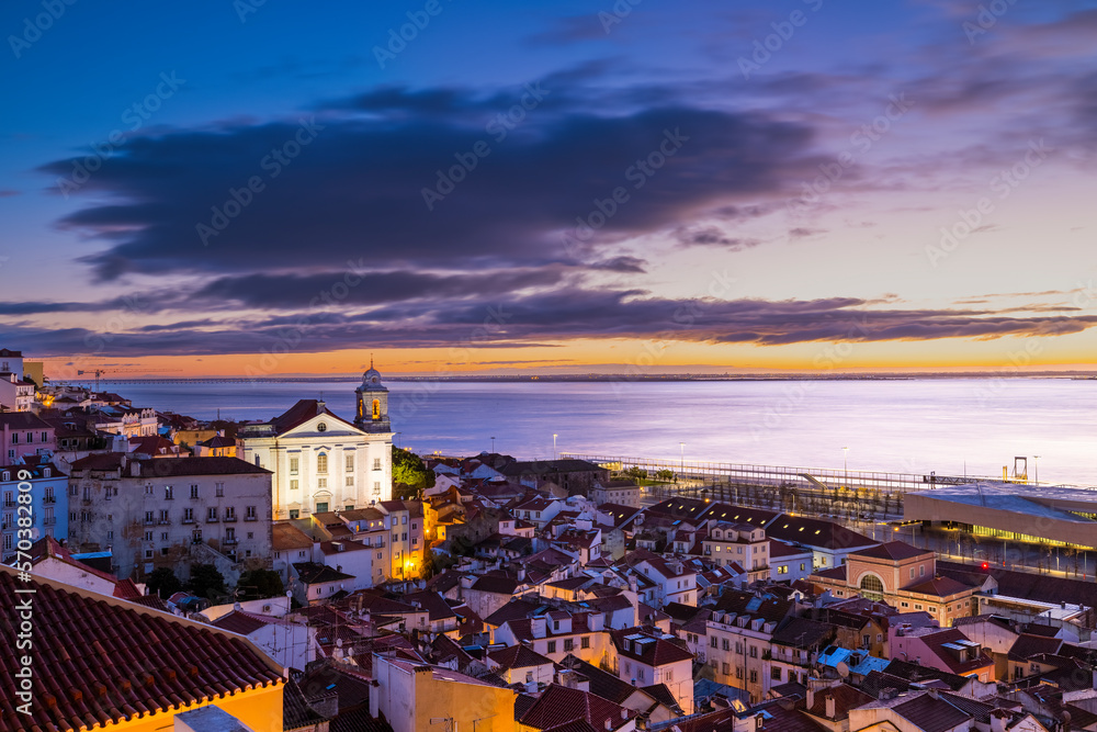 The Dawn of a New Day: A Breathtaking Sunrise View from Mirador de Santa Lucia in Lisbon.