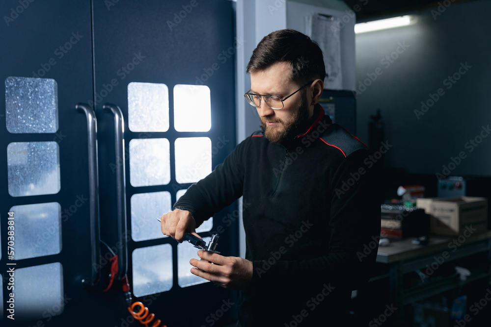 Industry Engineer working with metal detail after CNC machine turning cutting iron Industry Engineer working with metal detail after CNC machine turning cutting iron