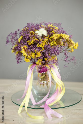 bouquet of yellow-violet dried flowers with largus photo