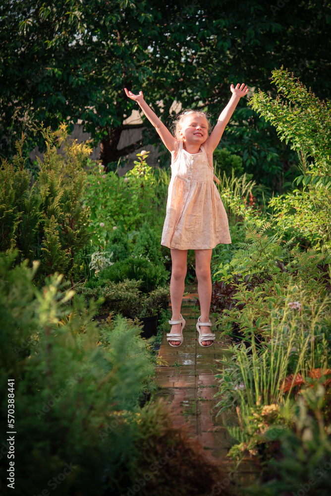The girl jumps and rejoices in the summer rain
The girl jumps and rejoices in the summer rain