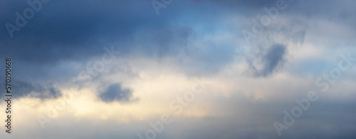 Fototapeta Naklejka Na Ścianę i Meble -  Dramatic sky with dark small clouds at sunset, panorama