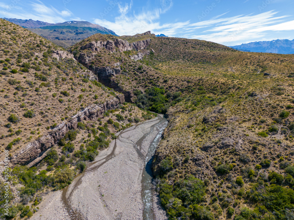 Aerial view of a creek running through the gorge of Quebrada El Diablo in Chile - Traveling on the Carretera Austral 