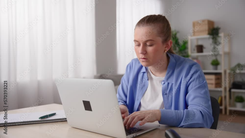 Pretty woman working from home on laptop and receiving bad news on laptop. Pretty woman working from home on laptop and receiving bad news on laptop.