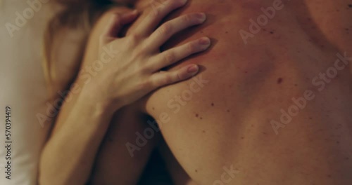 Celebrating sexual pleasure. 4K video footage of a young couple being intimate in bed at home.
