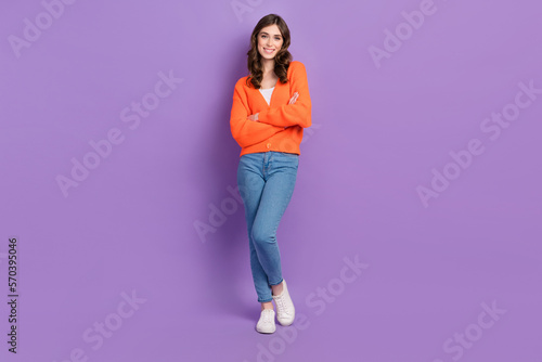 Full body size photo portrait of cheerful attractive girl crossed hands enjoy her trendy casual outfit isolated on violet color background