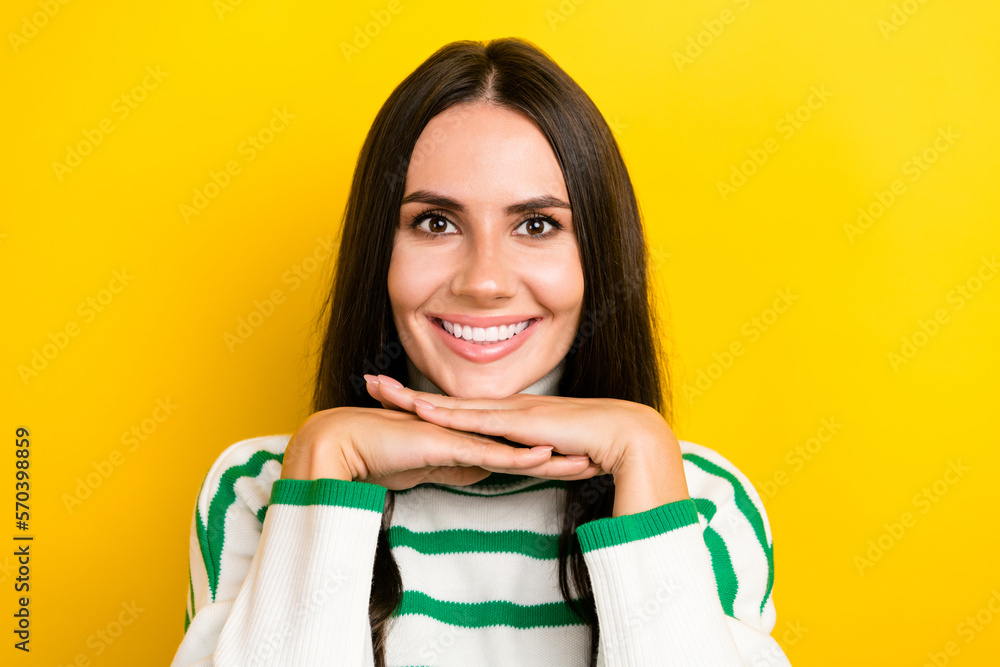 Photo of cute adorable lady dressed striped pullover arms chin smiling isolated yellow color background Photo of cute adorable lady dressed striped pullover arms chin smiling isolated yellow color background