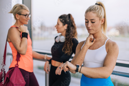 Three women are in the gym