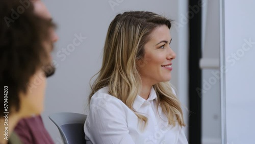 Corporate workers are agreeing and nodding heads in a meeting