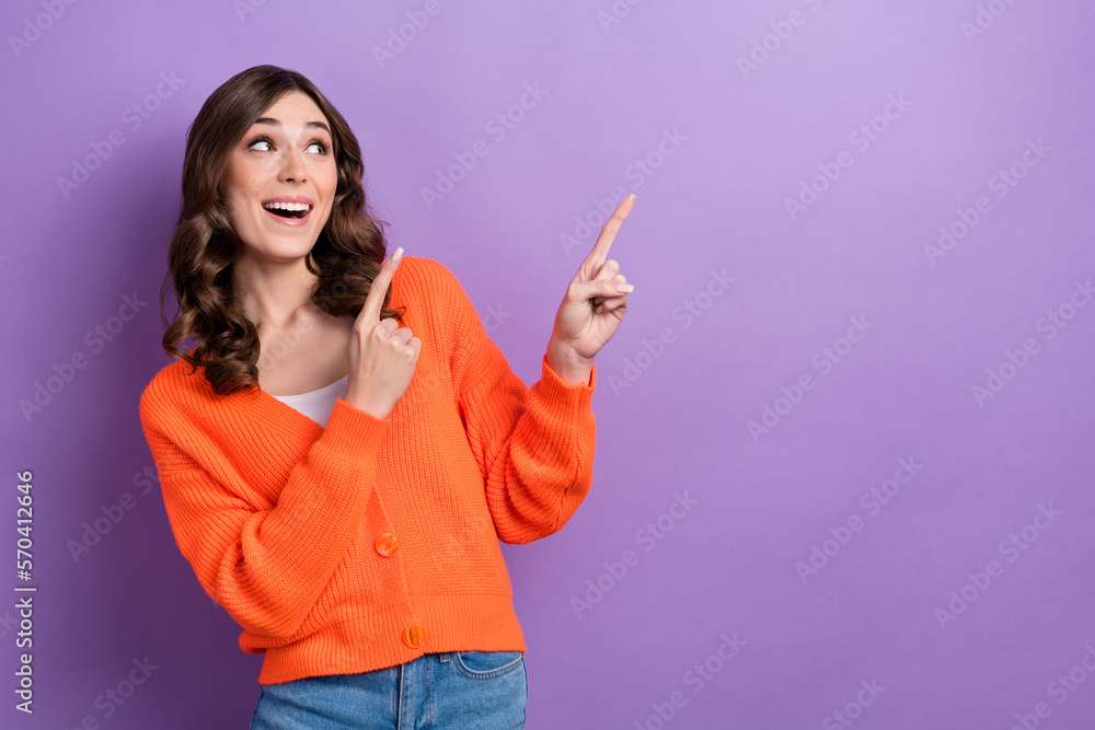 Portrait of impressed pretty lady look direct fingers empty space isolated on purple color background Portrait of impressed pretty lady look direct fingers empty space isolated on purple color background