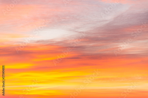 Sky with soft and fluffy pastel orange pink and blue colored clouds. Sunset background. Nature. sunrise. Instagram toned style