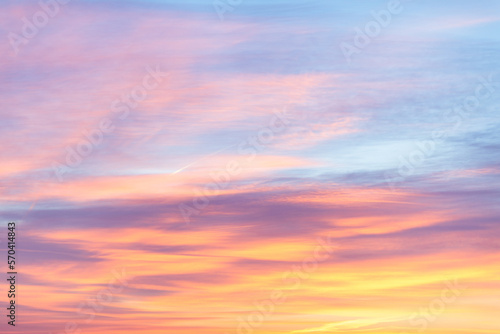 Sky with soft and fluffy pastel orange pink and blue colored clouds. Sunset background. Nature. sunrise. Instagram toned style © flowertiare
