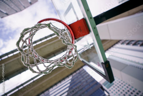 Low angle view of a basketball net under railroad in the city © Felix Mizioznikov