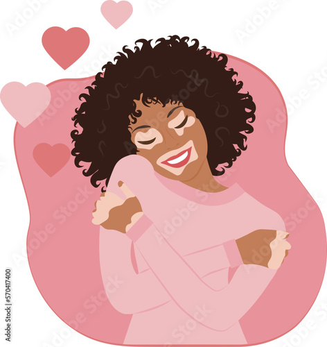 Black woman with vitiligo hugging herself and smiling