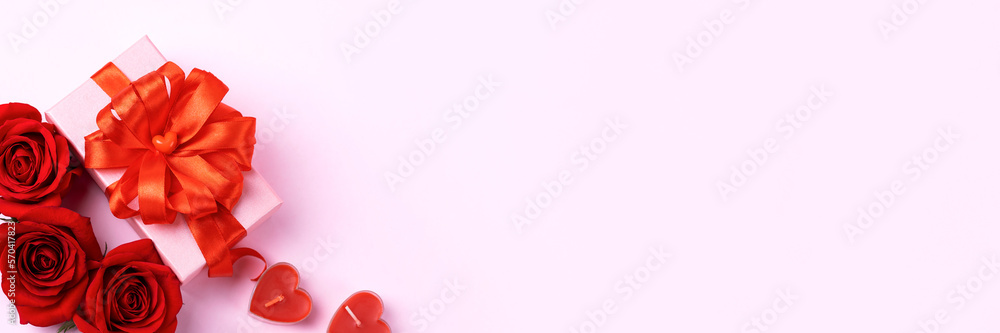 Happy Valentine's Day, Mother's Day and birthday greeting card. Red roses and pink gift box with a red satin ribbon bow and candles in the shape of hearts. Banner