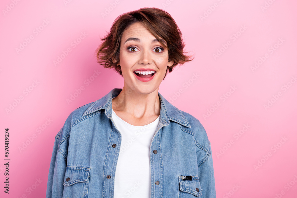 Portrait photo of astonished funny surprised girl wear denim jacket good news reaction unexpected pretty face isolated on pink color background Portrait photo of astonished funny surprised girl wear denim jacket good news reaction unexpected pretty face isolated on pink color background