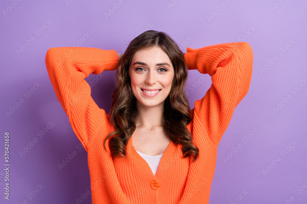 Photo of satisfied adorable person beaming smile arms behind head isolated on violet color background Photo of satisfied adorable person beaming smile arms behind head isolated on violet color background