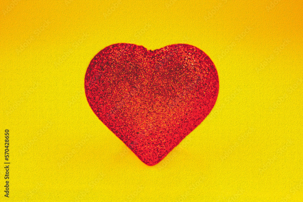 concept of the postcard with heart shape, red heart on the yellow background