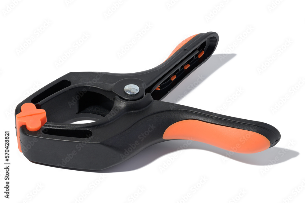 Large plastic clamp on a white isolated background Large plastic clamp on a white isolated background