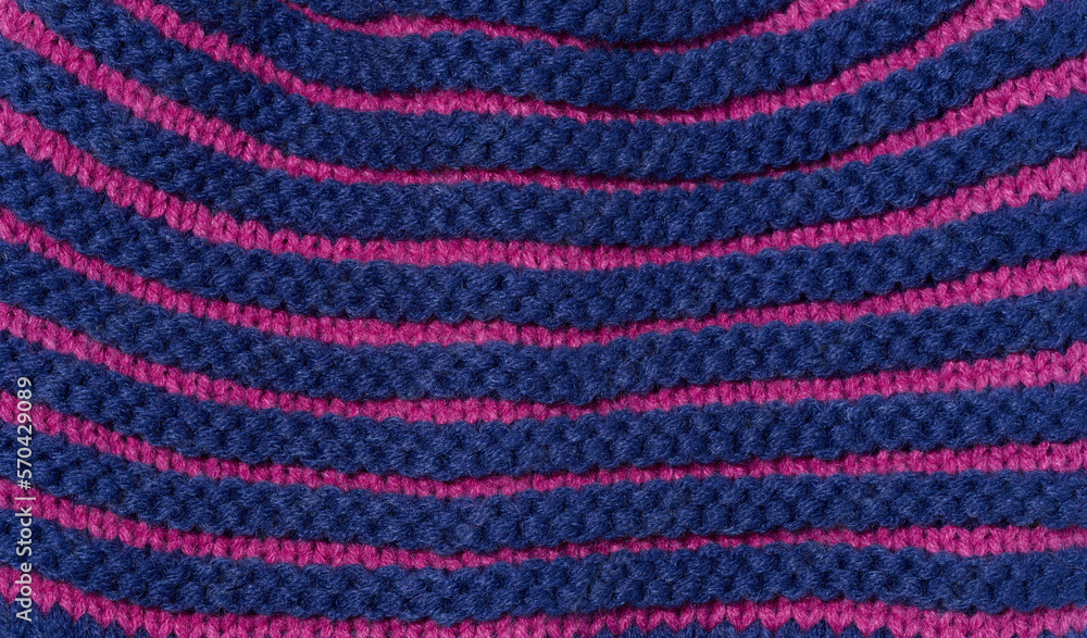 Texture of a knitted blue fabric. Detail of clothing