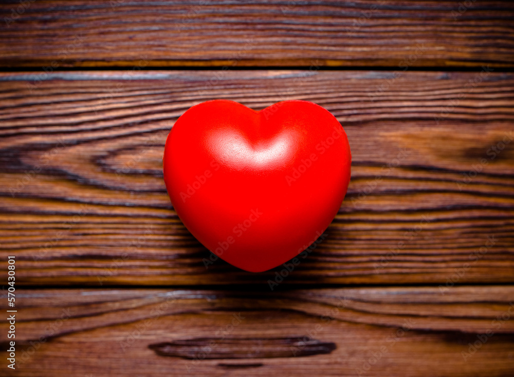 A symbol of love on brown wooden background
A symbol of love on brown wooden background