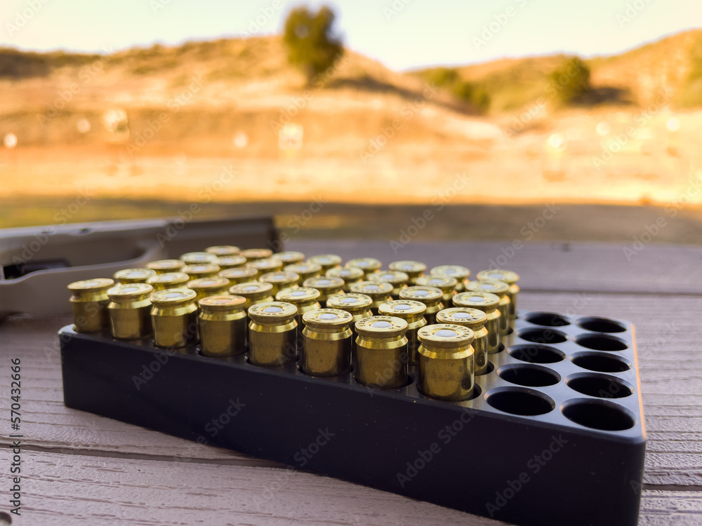 Tray of 9mm Lugger Bullet Rounds on Table at Shooting Range. Black ...