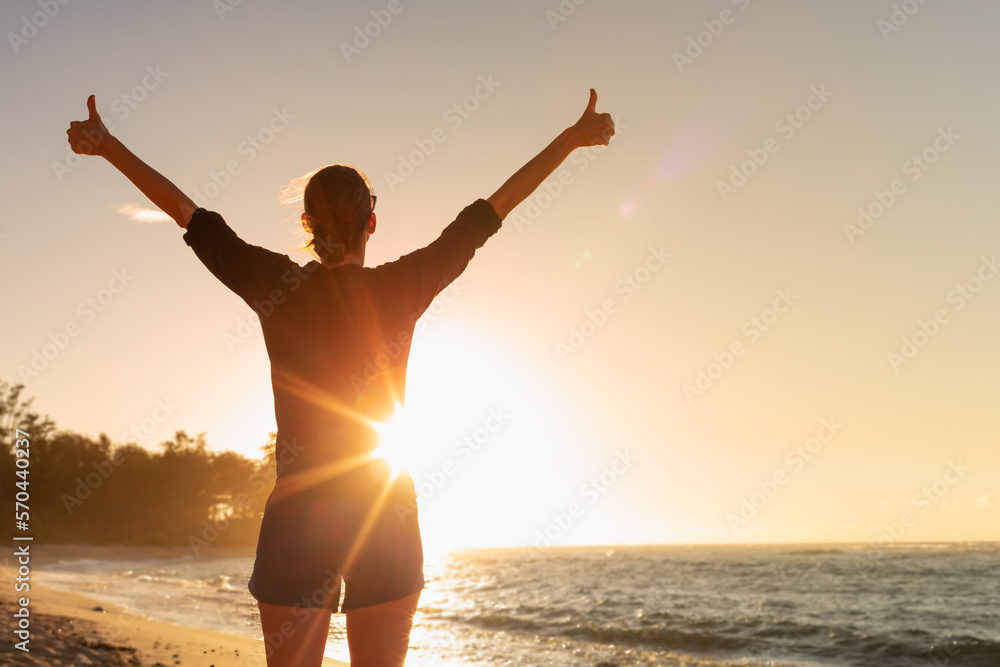 Young woman having a positive mindset, wellbeing, health hope concept. Thumbs up 