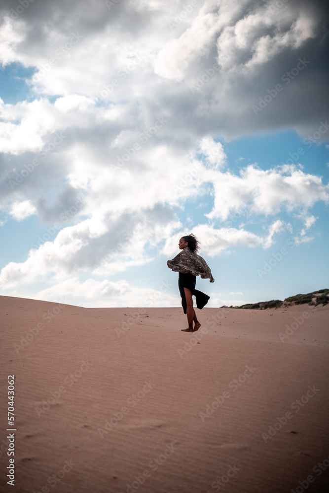 African girl walking with scarf in the wind African girl walking with scarf in the wind