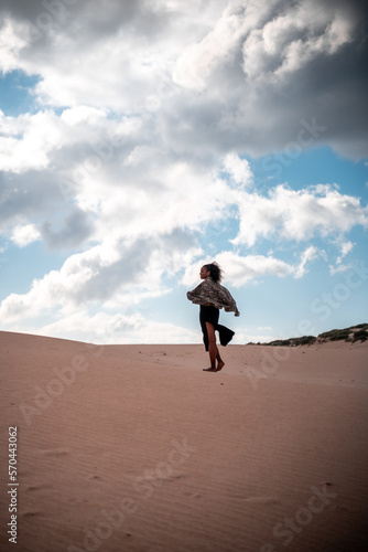 African girl walking with scarf in the wind © Roque Sánchez