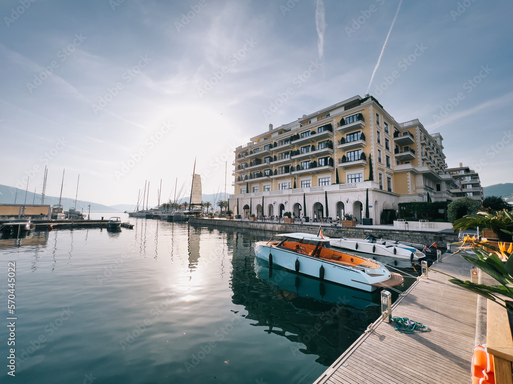 Small yachts are moored near the pier of the Regent Hotel in Porto. Montenegro