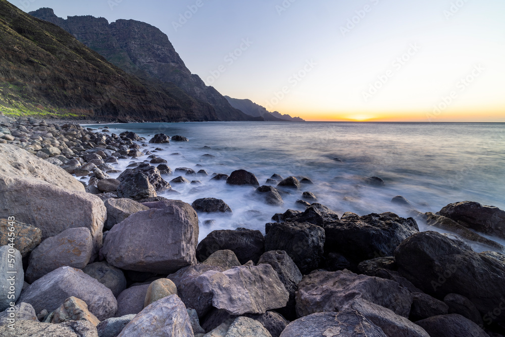 Rocks and Waves: A Majestic Sunset at the Beach