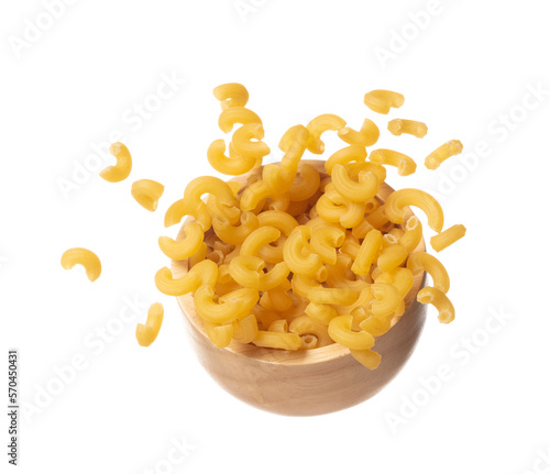 Photos Macaroni fall on wooden bowl, yellow macaronis pasta float explode, abstract cloud fly