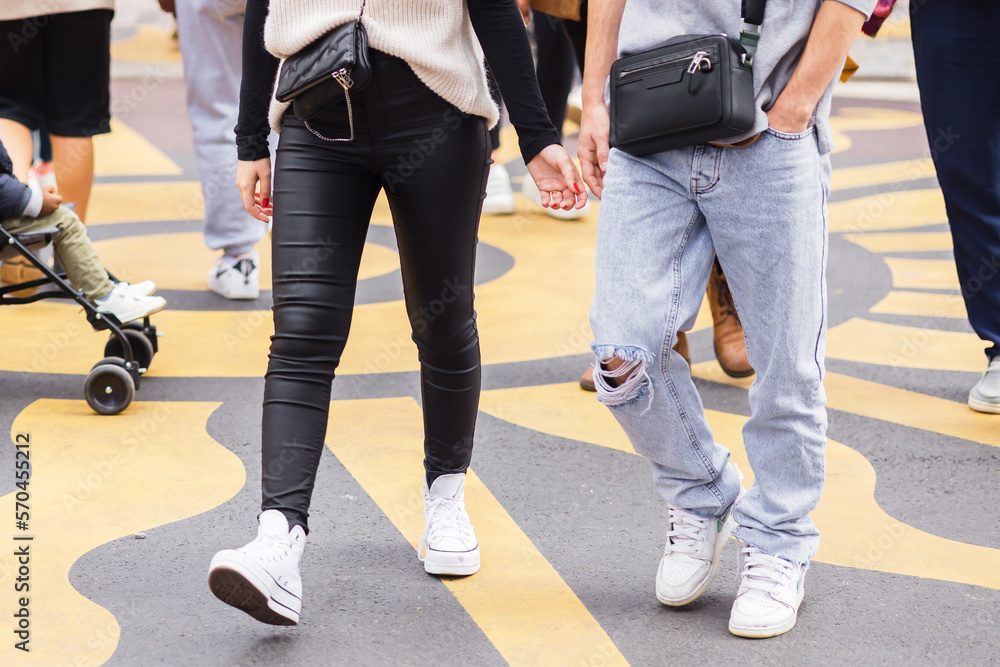 young couple walks on a city street young couple walks on a city street