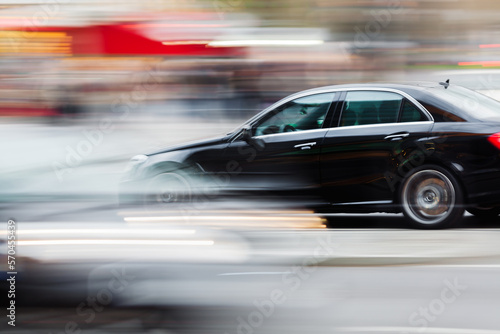 car in city traffic in abstract motion blur