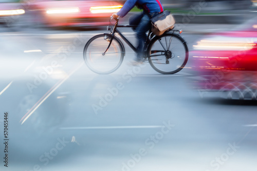 bicycle rider in city traffic