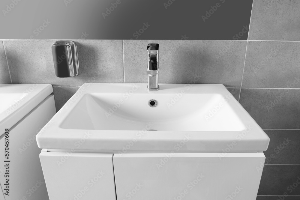 Fototapeta premium Beautiful clean sink near mirror in public toilet