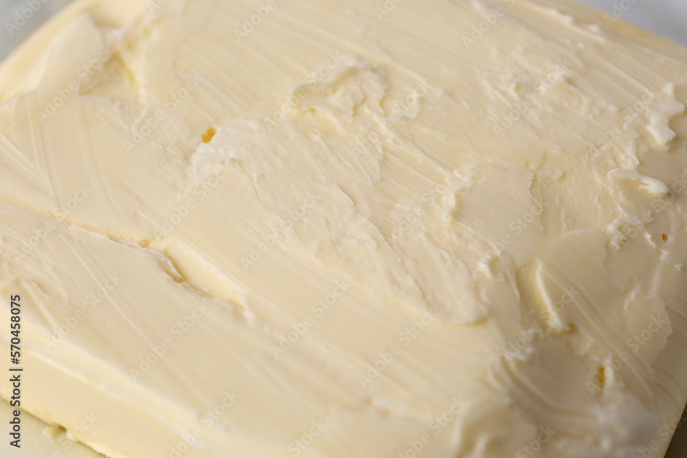 Piece of tasty homemade butter as background, closeup Piece of tasty homemade butter as background, closeup