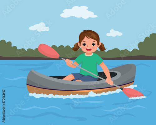 Cute little girl kayaking on the river