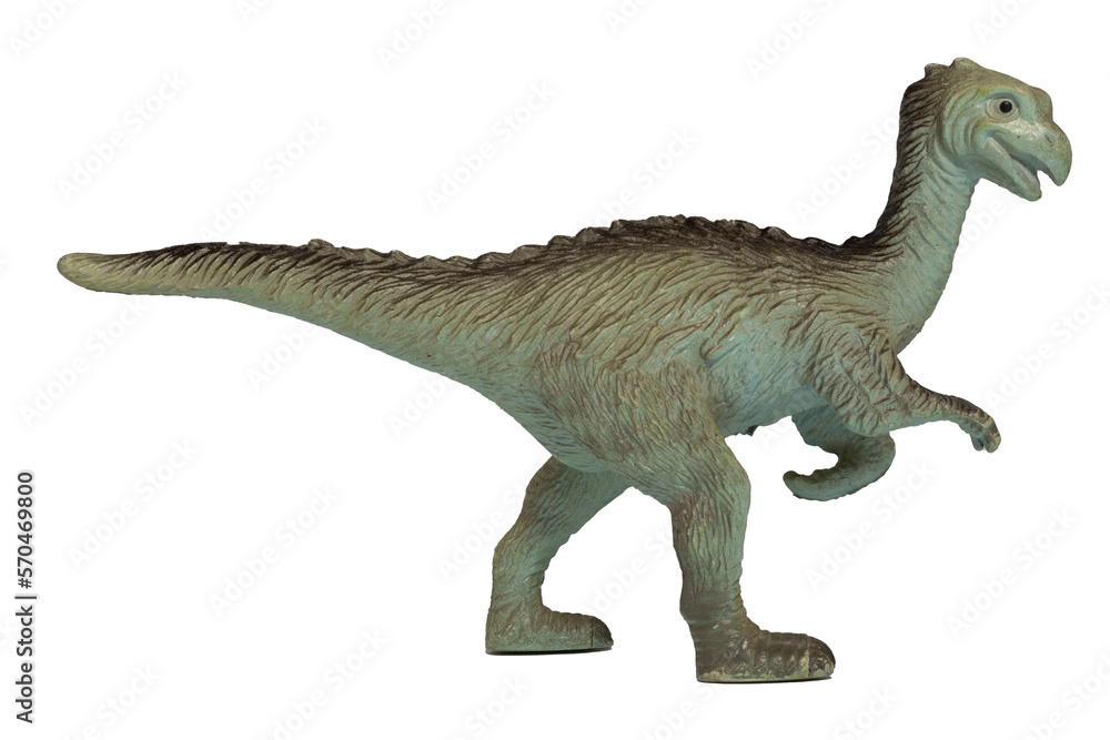 A worn plastic toy velociraptor isolated on a white background