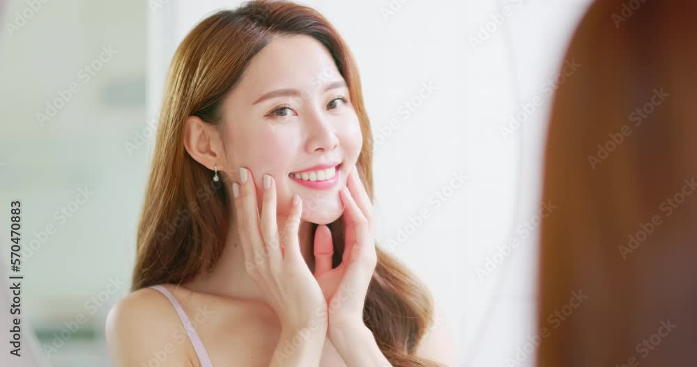 woman is looking in mirror woman is looking in mirror